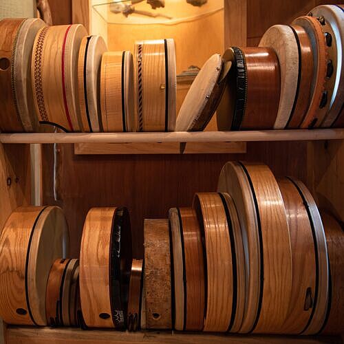 front view of frame drums in a rack in the studio