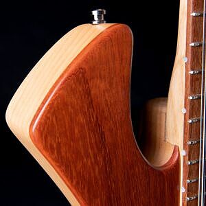 Padauk top wood on bass guitar