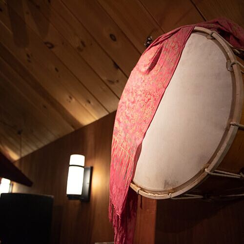 dhol a large drum hangs from the wall