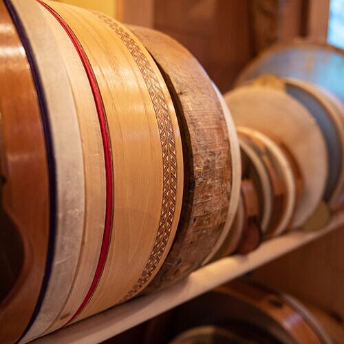 left view of frame drums in a rack in the studio