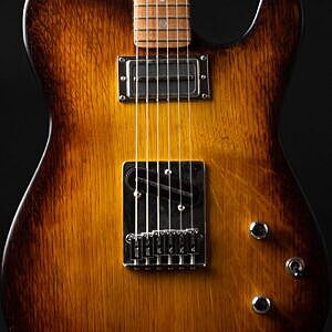 Detail of telecaster style guitar, oak burst